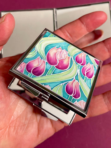 Pretty Pink Tulips Handbag Mirror - Pink and Green Flowers Compact Square Folding Pocket Makeup Mirror Gift for Her. present for Mum, Auntie, teacher, friend, daughter. metal case featuring pink tulip design on front with two mirrors inside.