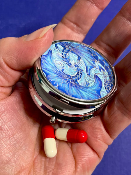 cute little round pill box featuring blue dragons intertwined in love. perfect get well gift. great present for lovers of the magical, mythical, mystical and fantasy. dragon lovers gift.