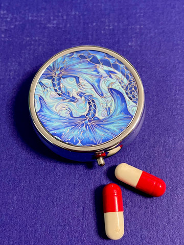 cute little round pill box featuring blue dragons intertwined in love. perfect get well gift. great present for lovers of the magical, mythical, mystical and fantasy. dragon lovers gift.