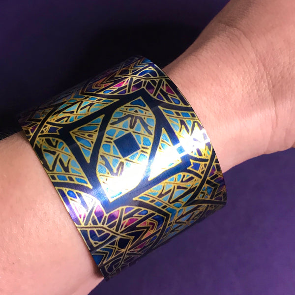 Cathedral Rose Window Bracelet in rich stained glass sunset colours- easy wear lightweight aluminium.