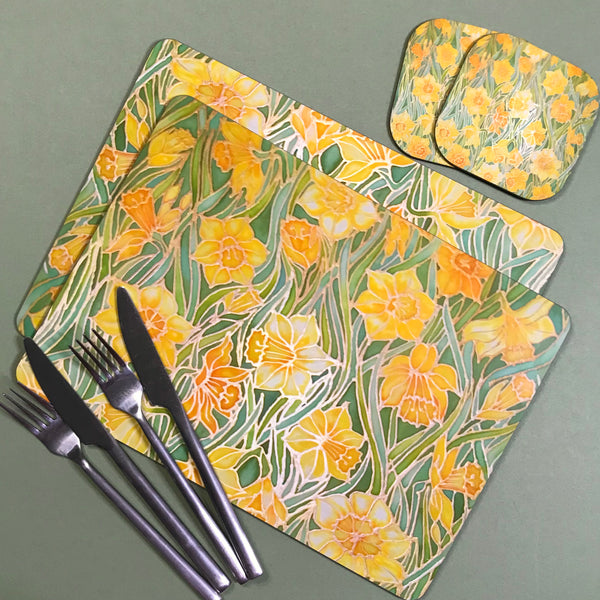Daffodil table mats Narcissus placemats & coasters. Yellow flower table setting. Hard wearing high quality table mats and coasters. Also available in this design are mugs, xl mugs, glass chopping boards, counter savers, platters, mouse mats, pet feeding mats, round placemats, square table mats.