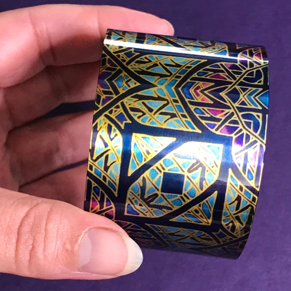 Cathedral Rose Window Bracelet in rich stained glass sunset colours- easy wear lightweight aluminium.