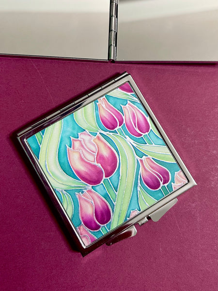 Pretty Pink Tulips Handbag Mirror - Pink and Green Flowers Compact Square Folding Pocket Makeup Mirror Gift for Her. present for Mum, Auntie, teacher, friend, daughter. metal case featuring pink tulip design on front with two mirrors inside.
