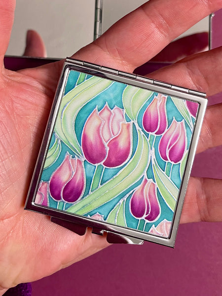 Pretty Pink Tulips Handbag Mirror - Pink and Green Flowers Compact Square Folding Pocket Makeup Mirror Gift for Her. present for Mum, Auntie, teacher, friend, daughter. metal case featuring pink tulip design on front with two mirrors inside.